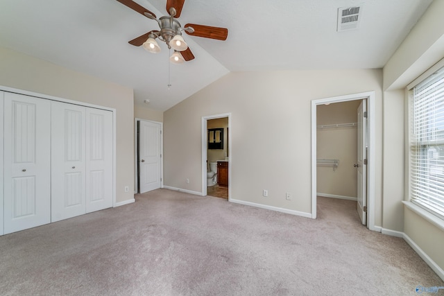 232 Falling Water Ln, Madison, AL 35756 - unfurnished bedroom featuring light colored carpet, a closet, lofted ceiling, baseboards, and ensuite bath