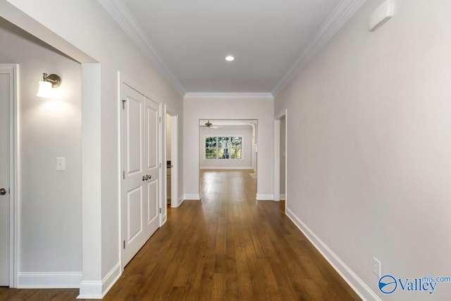 corridor featuring dark hardwood / wood-style floors and ornamental molding