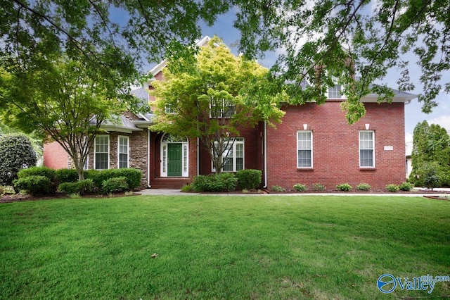 2924 Oakleigh Ln SE, Owens Cross Roads, AL 35763 - obstructed view of property featuring a front yard and stone siding