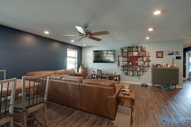 living room with ceiling fan and dark hardwood / wood-style flooring