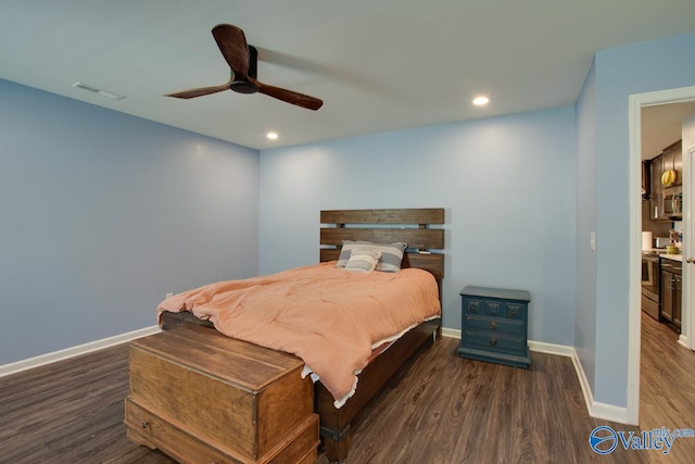 bedroom featuring ensuite bathroom, ceiling fan, and dark hardwood / wood-style floors