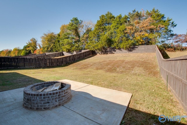 view of yard featuring a fire pit and a patio area