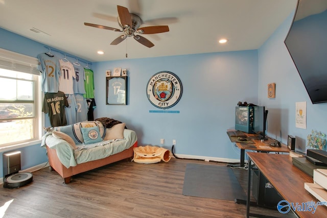 interior space with ceiling fan and wood-type flooring