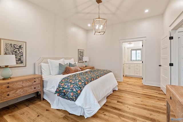 bedroom with connected bathroom, baseboards, a chandelier, light wood-type flooring, and recessed lighting