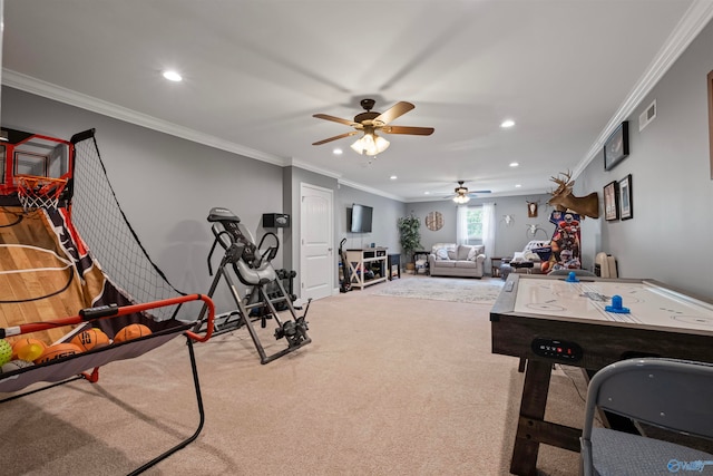 rec room with ceiling fan, ornamental molding, and carpet floors