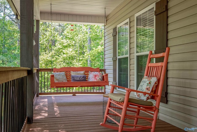 wooden terrace with a porch