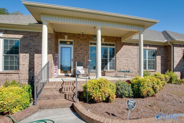 entrance to property featuring covered porch