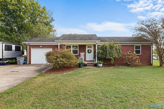 ranch-style house featuring a front lawn and a garage