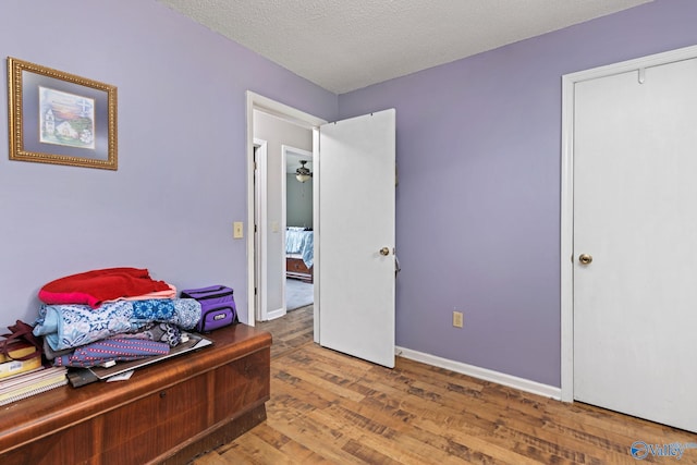 home office featuring hardwood / wood-style floors and a textured ceiling