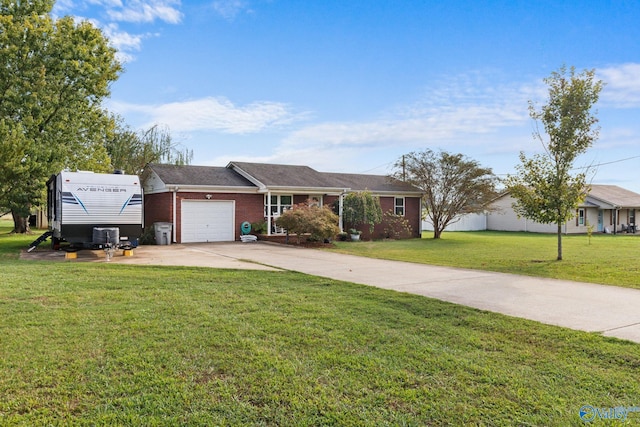 ranch-style home with a garage and a front yard