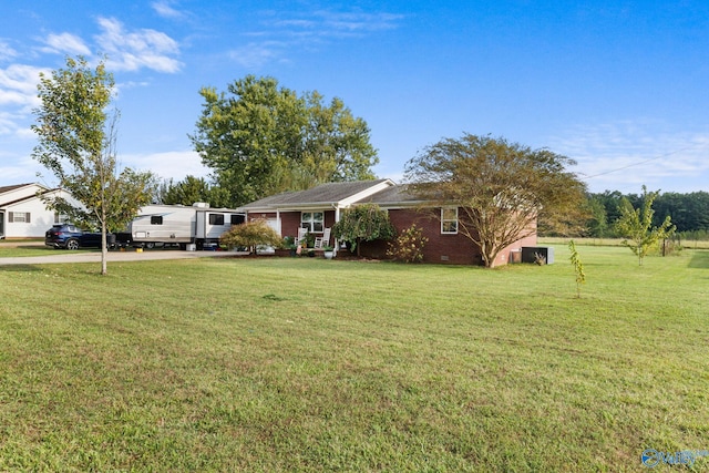 ranch-style home featuring a front yard