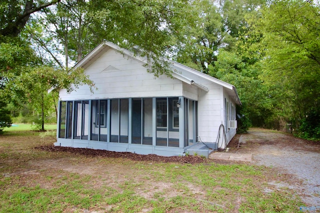 view of front facade featuring a sunroom