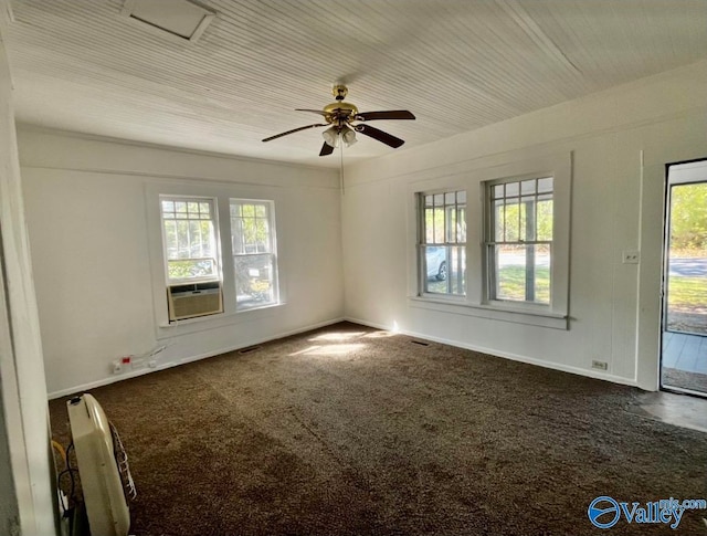 carpeted empty room featuring cooling unit and ceiling fan