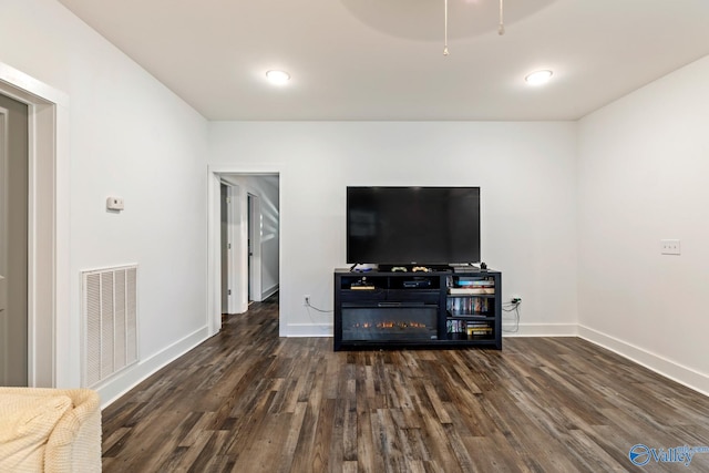 living room with dark hardwood / wood-style floors