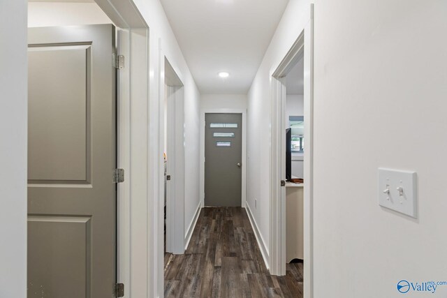 hallway featuring dark hardwood / wood-style flooring