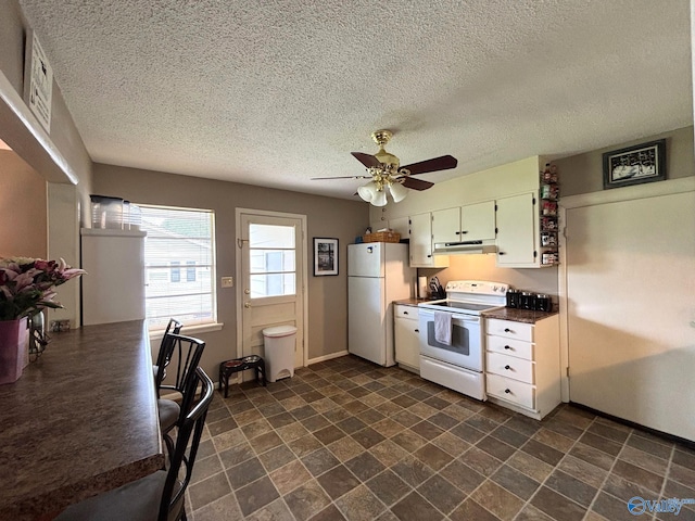 1300 7th Ave, Athens, AL 35611 - kitchen with white appliances, a textured ceiling, ceiling fan, under cabinet range hood, and white cabinetry
