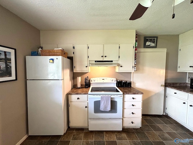 1300 7th Ave, Athens, AL 35611 - kitchen with white appliances, under cabinet range hood, dark countertops, white cabinets, and a ceiling fan