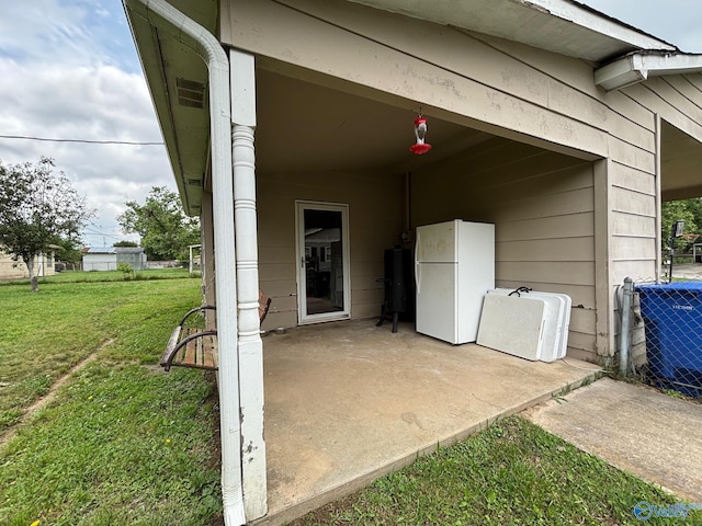 1300 7th Ave, Athens, AL 35611 - property entrance featuring a patio, a lawn, and central AC unit