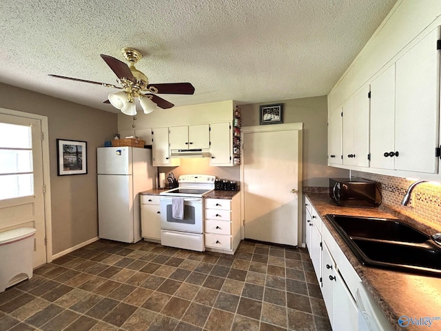 1300 7th Ave, Athens, AL 35611 - kitchen with white appliances, under cabinet range hood, a sink, white cabinets, and a textured ceiling