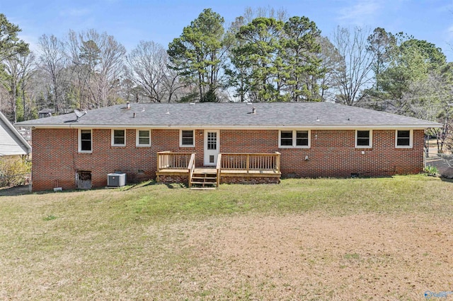 rear view of house with a wooden deck, a yard, crawl space, central air condition unit, and brick siding