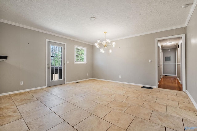 unfurnished room with light tile patterned flooring, visible vents, a textured ceiling, and ornamental molding