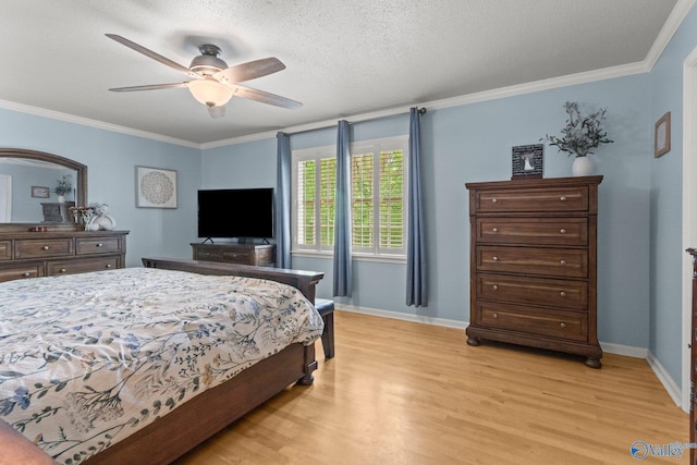 bedroom featuring baseboards, ornamental molding, and light wood-style floors