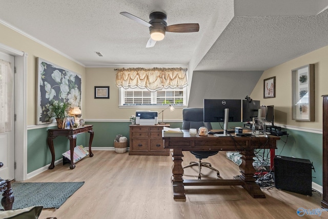 home office with a textured ceiling, visible vents, ornamental molding, wood finished floors, and a ceiling fan