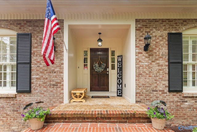 entrance to property with brick siding