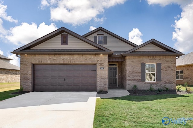 view of front of home featuring a garage and a front lawn