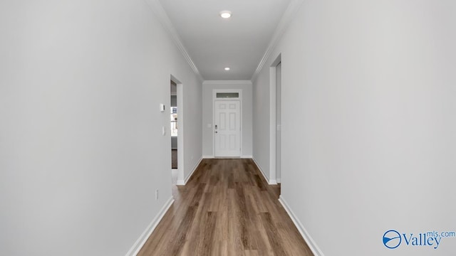 hall featuring crown molding and wood-type flooring