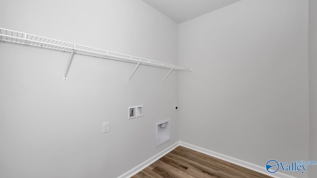 washroom featuring hookup for a washing machine, hookup for an electric dryer, and hardwood / wood-style flooring