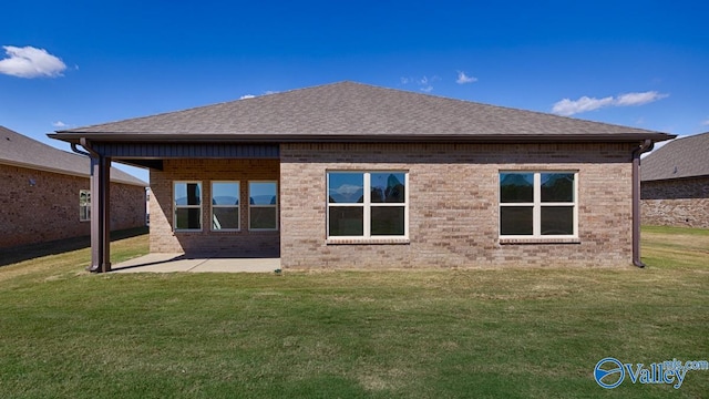 back of house featuring a yard and a patio