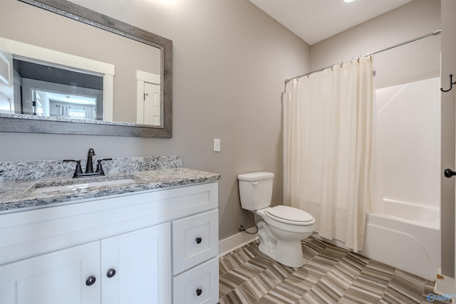 full bathroom with vanity, toilet, tile patterned floors, and shower / tub combo