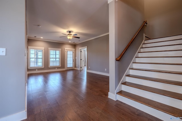 interior space with dark wood-type flooring, crown molding, and ceiling fan