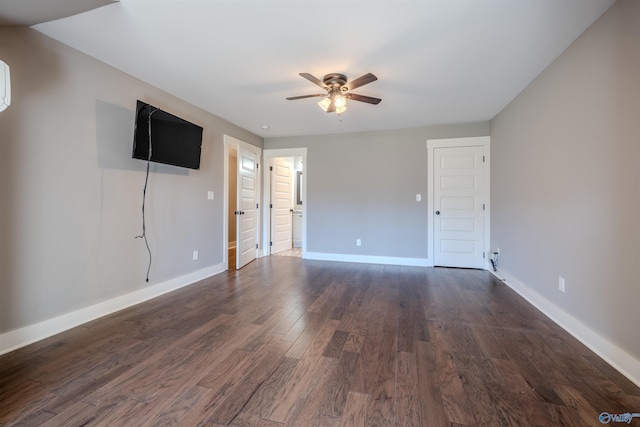 unfurnished room featuring ceiling fan and dark hardwood / wood-style flooring