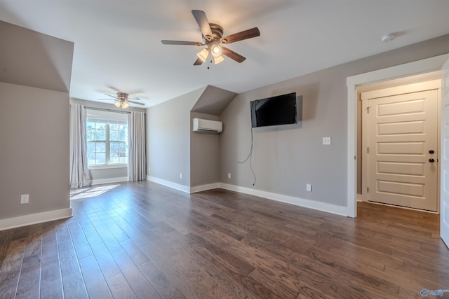 unfurnished living room with ceiling fan, dark hardwood / wood-style flooring, and a wall unit AC