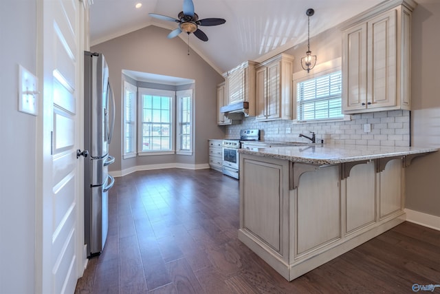 kitchen featuring backsplash, dark hardwood / wood-style flooring, a kitchen breakfast bar, hanging light fixtures, and stainless steel appliances