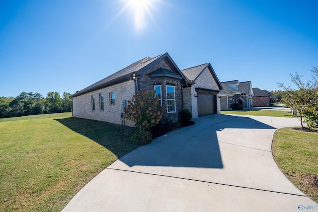 view of front of house with a front lawn and a garage