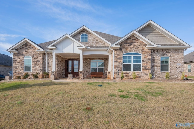 craftsman house featuring a front lawn