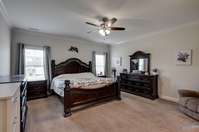 carpeted bedroom featuring ornamental molding and ceiling fan