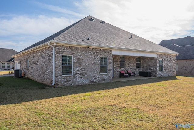 back of house featuring a patio area, central AC unit, and a lawn