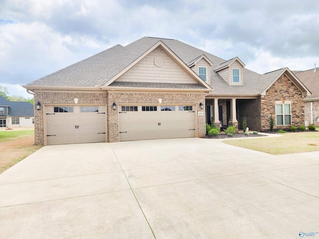 414 Wood Sage Ln, Huntsville, AL 35824 - craftsman house with a shingled roof, a garage, driveway, and brick siding