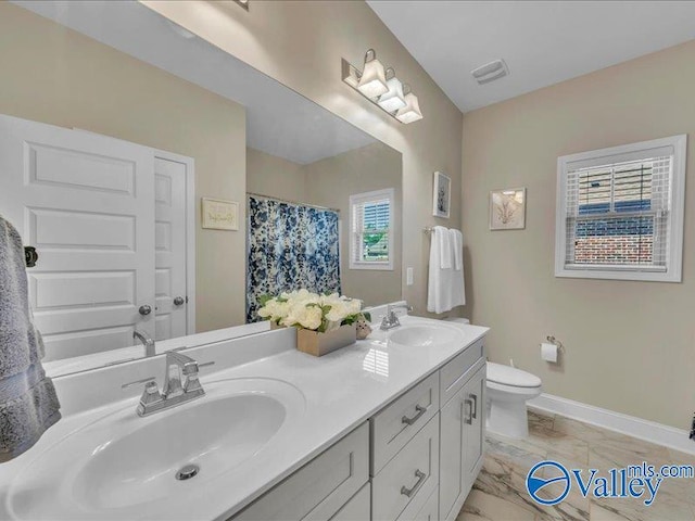 414 Wood Sage Ln, Huntsville, AL 35824 - bathroom with a sink, visible vents, toilet, and baseboards