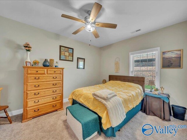 414 Wood Sage Ln, Huntsville, AL 35824 - bedroom featuring light carpet, ceiling fan, baseboards, and visible vents