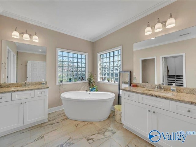 414 Wood Sage Ln, Huntsville, AL 35824 - full bathroom featuring a freestanding tub, two vanities, a sink, and ornamental molding