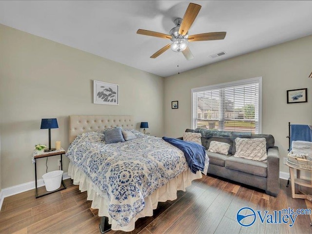 414 Wood Sage Ln, Huntsville, AL 35824 - bedroom with dark wood-style flooring, visible vents, baseboards, and ceiling fan