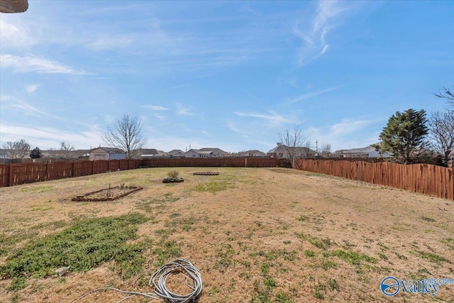view of yard with a fenced backyard