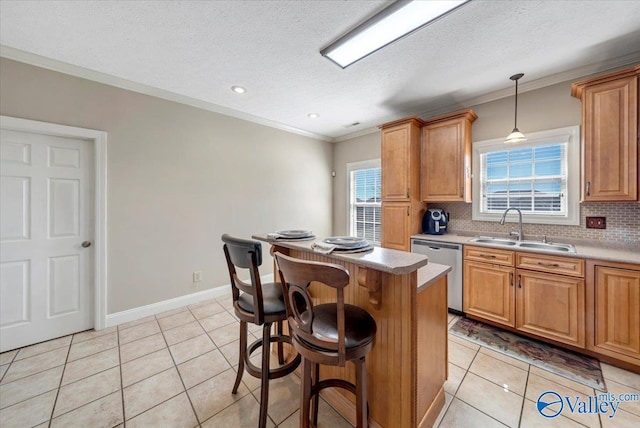 kitchen featuring a sink, decorative backsplash, light tile patterned floors, ornamental molding, and stainless steel dishwasher