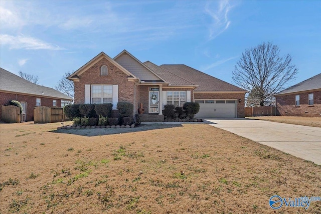 ranch-style house featuring a front yard, brick siding, concrete driveway, an attached garage, and fence
