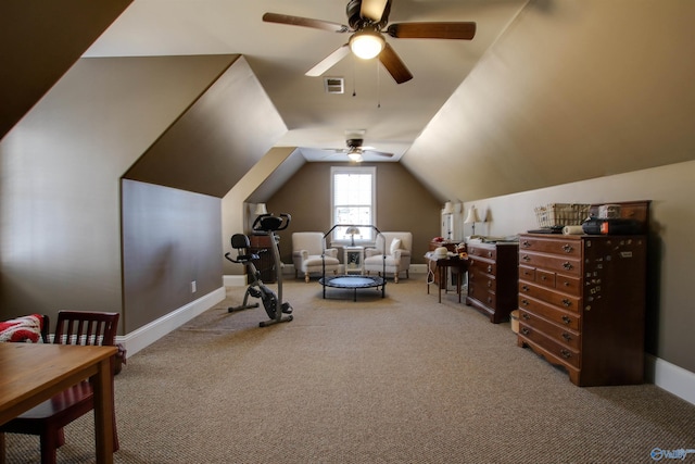 exercise room featuring ceiling fan, carpet, and lofted ceiling